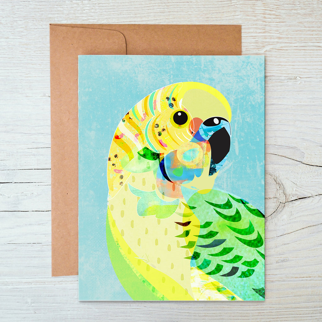 A6 Notecard with a green and yellow Budgerigar bird illustration on light blue background.