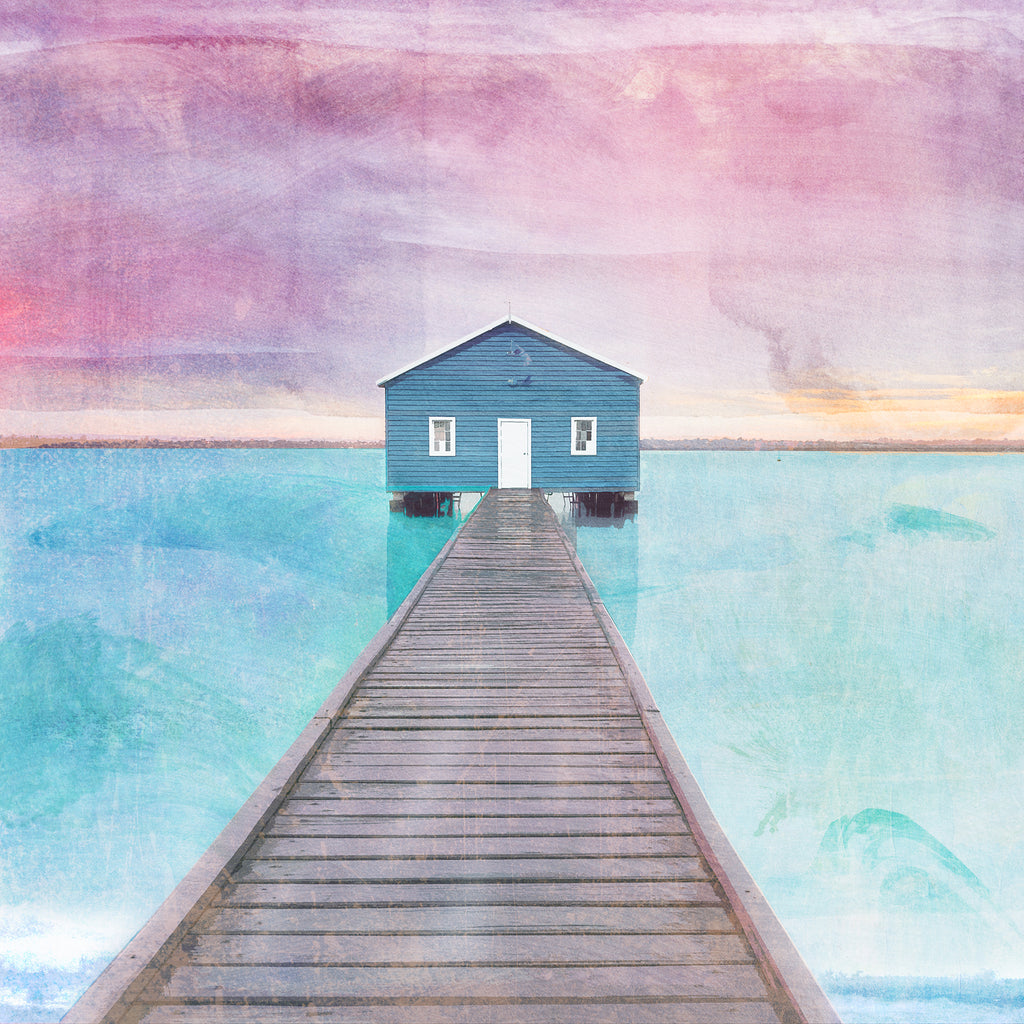 Square notecard with illustration of the blue Crawley Boathouse at the end of the pier with turquoise water and pink sky.