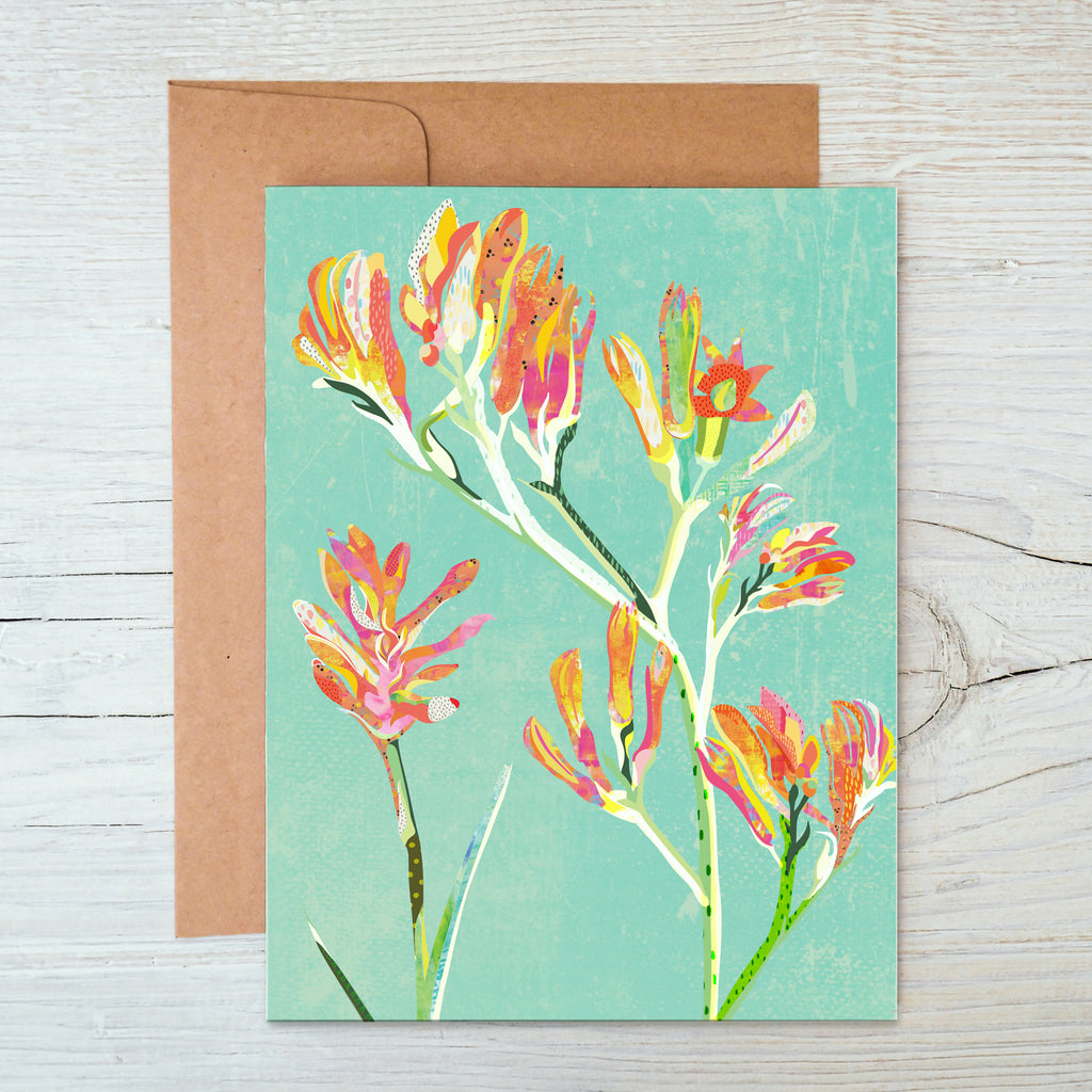 A6 Notecard with a red, yellow, orange and pink kangaroo paw flowers illustration on a mint green background.