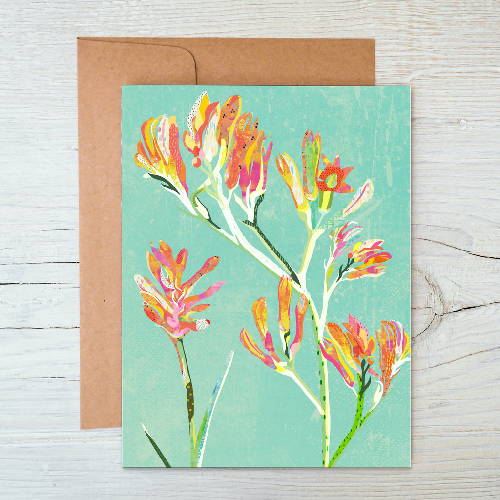 A6 Notecard with a red, yellow, orange and pink kangaroo paw flowers illustration on a mint green background.
