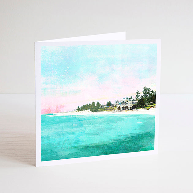 Square notecard with illustration of Cottesloe Beach and the Indiana teahouse surrounded by trees during sunset.